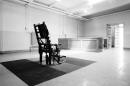 FILE - This May 17, 1968 file photo shows an empty electric chair in the Death House at Sing Sing Prison in Ossining, N.Y. In the background is the witness bench and room entrance. America's executions have changed dramatically over the years, morphing from day-long events in the town square to somber and tightly controlled affairs held deep inside prisons. (AP File Photo)