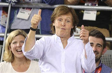 Paul McCartney celebrates after Britain&#39;s Dani King, Laura Trott and Joanna Rowsell won the track cycling women&#39;s team pursuit gold finals at the London 2012 Olympic Games