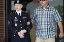 FILE - In this June 25, 2013 file photo, Army Pfc. Bradley Manning, left, is escorted out of a courthouse in Fort Meade, Md. A military judge is weighing the admissibility of three pieces of evidence suggesting Manning took his cues from WikiLeaks in disclosing classified information. Col. Denise Lind says she's preparing to rule as Manning's court-martial resumes Friday, June 28, 2013. (AP Photo/Jose Luis Magana, File)