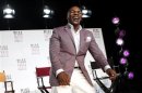 Former heavyweight champion Tyson laughs as he talks about the Broadway debut of his one-man show "Mike Tyson: Undisputed Truth" during a news conference in New York