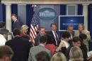 Pool TV video still shows White House Press Secretary Earnest and correspondents departing White House press briefing room after it was cleared in the middle of an afternoon briefing in Washington