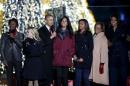 U.S. President Barack Obama and family sing Christmas carols with singer Blacc and actress Witherspoon during the National Christmas Tree Lighting and Pageant of Peace ceremony in Washington