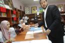 Abdel Hakim Belhadj, leader of Al-Watan party and former head of the Tripoli military counsel casts his vote at a polling station in Tripoli