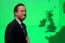 Britain's Prime Minister David Cameron walks past a map of Europe on a screen as he walks away after making a speech on holding a referendum on staying in the European Union in London, Wednesday, Jan. 23, 2013. Cameron said Wednesday he will offer British citizens a vote on whether to leave the European Union if his party wins the next election, a move which could trigger alarm among fellow member states. He acknowledged that public disillusionment with the EU is "at an all-time high," using a long-awaited speech in central London to say that the terms of Britain's membership in the bloc should be revised and the country's citizens should have a say. (AP Photo/Matt Dunham)