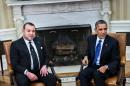 King Mohammed VI of Morocco (L) and US President Barack Obama talk with the press before a meeting in the Oval Office of the White House November 22, 2013 in Washington