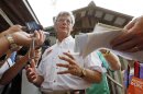 Gov. Phil Bryant speaks with reporters following his morning address at the Neshoba County Fair in Philadelphia, Miss., Thursday, Aug. 2, 2012. The fair is a traditional gathering place for fairgoers, politicians, area residents, business leaders and voters. (AP Photo/Rogelio V. Solis)