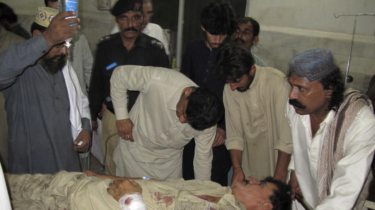 A Pakistani man who was injured in a suicide bombing at a residence of a provincial government minister, receives treatment at a hospital in Dera Ismail Khan, Pakistan, Wednesday, Oct. 16, 2013. A suicide bomber shot his way into the residence of a provincial government minister Wednesday in northwestern Pakistan, killing the official and several others in an explosion, police said. (AP Photo/Ishtiaq Mahsud)