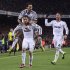 Real's Cristiano Ronaldo from Portugal, from left, Alvaro Arbeloa  and Sergio Ramos celebrate after scoring during a Copa del Rey soccer match between FC Barcelona and Real Madrid at the Camp Nou stadium in Barcelona, Spain, Tuesday, Feb. 26, 2013. (AP Photo/Manu Fernandez)