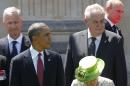 U.S. President Barack Obama watches as Russian President Vladimir Putin walks to his position