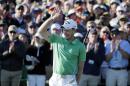 Danny Willett, of England, celebrates on the 18th hole after finishing the final round of the Masters golf tournament Sunday, April 10, 2016, in Augusta, Ga. (AP Photo/Charlie Riedel)