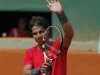 Nadal of Spain waves after winning his match against Istomin of Uzbekistan during the French Open tennis tournament at the Roland Garros stadium in Paris