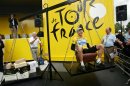 FILE - In this July 7, 2005, file photo, Lance Armstrong laughs as he has his weight matched with boxes containing champagne bottles while seated on a scale before the sixth stage of the Tour de France cycling race between Troyes and Nancy, eastern France. In 2012 Armstrong was stripped of his Tour de France titles, lost most of his endorsements and was forced to leave the Livestrong foundation last year after the U.S. Anti-Doping Agency issued a damning, 1,000-page report that accused him of masterminding a long-running doping scheme. (AP Photo/Christophe Ena, File)