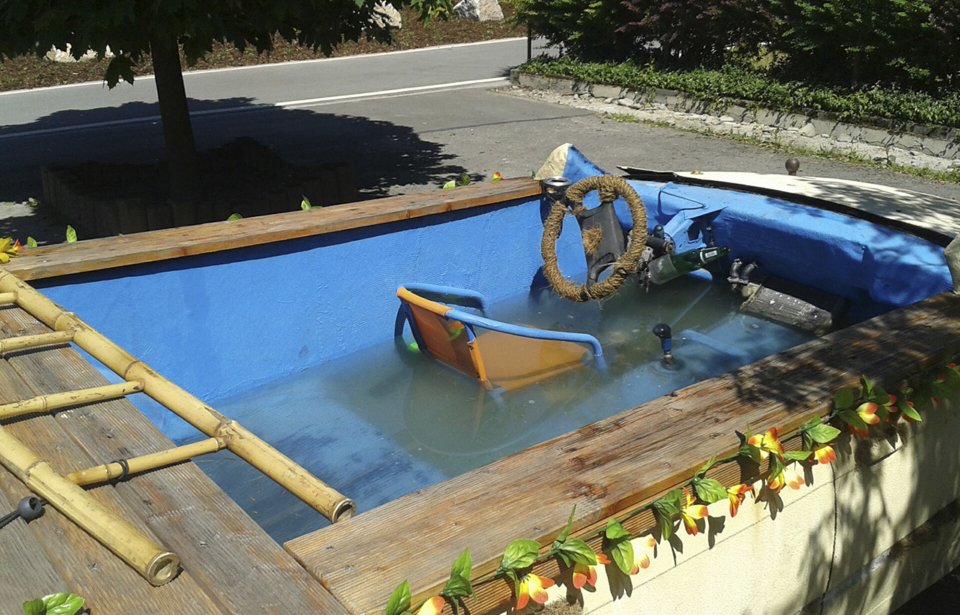 The photo provided by the police in Chemnitz on June 23, 2013 shows a car that has been converted into a driveable pool in Eibenstock, eastern Germany. Young people from the Erzgebirge mountains have converted their car into a pool. Four people fled from the car when it was stopped by a police officer. (AP Photo/Polizei Chemnitz)