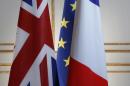 Britain, European and French flags are seen before a news conference at the Elysee Palace in Paris