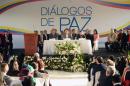 Colombian government representative Juan Camilo Restrepo (C-L), Ecuadorean Foreign Minister Guillaume Long (C) and Colombia's ELN guerrilla member Pablo Beltran (C-R) attend peace talks in Sangolqui, Ecuador on February 7, 2017
