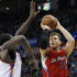 Los Angeles Clippers forward Blake Griffin shoots over Oklahoma City Thunder center Kendrick Perkins in the second quarter of an NBA basketball game in Oklahoma City, Wednesday, Nov. 21, 2012. (AP Photo/Sue Ogrocki)
