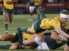 South Africa's Pienaar is challenged by Australia's Wallabies' McCabe and Hooper during their Rugby Championship test match in Pretoria