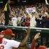 Washington Nationals players high-five as fans celebrate their 4-1 win against the Los Angeles Dodgers to clinch a playoff spot after their baseball game at Nationals Park in Washington, Thursday, Sept. 20, 2012. (AP Photo/Jacquelyn Martin)