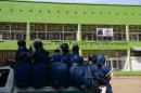 Burundian riot police drive in Bujumbura on April 29, 2015