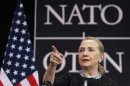 U.S. Secretary of State Clinton addresses a news conference during a NATO foreign ministers meeting in Brussels