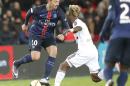 PSG's Zlatan Ibrahimovic, left, and Lorientss Didier Ndong challenge for the ball during a French League One soccer Match, Paris Saint Germain against Lorient at Parc des Princes stadium in Paris, Wednesday, Feb. 3, 2016. (AP Photo/Michel Euler)