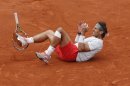 Spain's Rafael Nadal celebrates winning against compatriot David Ferrer in three sets 6-3, 6-2, 6-3, in the final of the French Open tennis tournament, at Roland Garros stadium in Paris, Sunday June 9, 2013. (AP Photo/Christophe Ena)