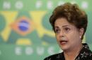 Brazil's President Dilma Rousseff reacts during a ceremony to announce measures to modernize Brazilian soccer at the Planalto Palace in Brasilia