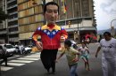 A person wearing a giant puppet depicting Venezuela's President Hugo Chavez crosses a street in downtown Caracas, Venezuela, Thursday, Sept. 27, 2012. Venezuela's presidential election is scheduled for Oct. 7. (AP Photo/Ariana Cubillos)