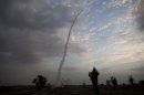 An Iron Dome missile is launched in Tel Aviv, to intercept a rocket fired from Gaza, Saturday, Nov. 17, 2012. Israel bombarded the Hamas-ruled Gaza Strip with nearly 200 airstrikes early Saturday, the military said, widening a blistering assault on Gaza rocket operations to include the prime minister's headquarters, a police compound and a vast network of smuggling tunnels. (AP Photo/Oded Balilty)