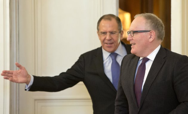 Russian Foreign Minister Sergey Lavrov, left, welcomes his Dutch counterpart Frans Timmermans for a meeting in Moscow, Russia, Tuesday, Feb. 26, 2013. (AP Photo/Misha Japaridze)