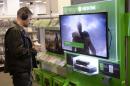 A customer looks at a display of Microsoft's next-generation console, the Xbox One at Best Buy in Union Square in New York November 19, 2013