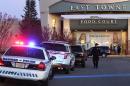 Authorities respond to reports of shots fired at East Towne Mall in Madison, Wis., Saturday, Dec. 19, 2015. Madison police said one person was shot in the leg during a 
