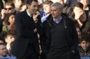 Chelsea's manager Mourinho speaks with his Sunderland counterpart Poyet during their English Premier League soccer match in London