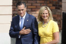 US Republican presidential candidate, former Massachusetts Gov. Mitt Romney with wife Ann gesture to Polish WWII veterans and a survivor of a Nazi concentration camp prior to laying a wreath at the Warsaw 1944 Uprising monument in Warsaw, Poland, Tuesday, July 31, 2012. (AP Photo/Alik Keplicz)