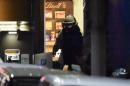 A bomb disposal expert leaves the Lindt cafe after a hostage siege in Sydney on December 16, 2014