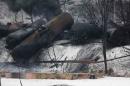 A CSX Corp train continues burning a day after derailing in Mount Carbon, West Virginia