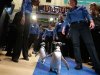 Penguins from SeaWorld are escorted by their handlers on the floor of the New York Stock Exchange during the company's IPO, Friday, April 19, 2013, in New York. The broad Standard & Poor's 500 index opened higher early Friday. (AP Photo/Richard Drew)