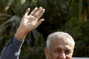 FILE - In this Feb, 6, 2009 file photo, Pakistan's nuclear scientist Abdul Qadeer Khan waves outside his residence in Islamabad, Pakistan. Khan, who made Pakistan into a nuclear power and later took responsibility for leaking atomic secrets to Iran, North Korea and Libya has started a new movement aimed at shaking up the country's political scene ahead of upcoming national elections. (AP Photo/B.K.Bangash, File)