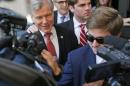 Former Virginia Gov. Bob McDonnell, left, is swarmed by the media as he leaves Federal Court for the third day of jury deliberations in his corruption trial in Richmond, Va., Thursday, Sept. 4, 2014. McDonnell and his wife Maureen are charged in a 14-count indictment with doing special favors for Jonnie Williams, the CEO of dietary supplements maker Star Scientific Inc., in exchange for $165,000 in gifts and loans. (AP Photo/Steve Helber)