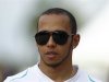 Mercedes Formula One driver Lewis Hamilton of Britain walks after the second practice session of the Malaysian F1 Grand Prix at Sepang International Circuit outside Kuala Lumpur