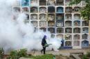 A specialist fumigates for Zika-carrying mosquitoes on the outskirts of Lima, Peru on January 15, 2016