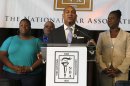 Sybrina Fulton stands with National Bar Association President John Page and Nathaniel and Cleopatra Pendleton at a news conference in Miami Beach