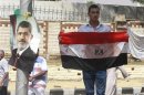A supporter of deposed Egyptian President Mohamed Mursi holds a bloodied flag outside the Republican Guard headquarters in Cairo
