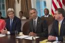 US President Barack Obama speaks during a Cabinet meeting at the White House in Washington, DC, on May 21, 2015 as Secretary of State John Kerry (L) and Defense Secretary Ashton Carter (R) look on