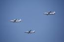 FILE - In this Sept. 3, 2015 file photo, a KJ-200 airborne early warning and control plane, left, a Y-8J radar plane, center, and a Y-9JB radar plane, right, fly in formation during a parade commemorating the 70th anniversary of Japan's surrender during World War II in Beijing. The U.S. Pacific Command says a Chinese aircraft and a U.S. Navy patrol plane had an "unsafe" encounter over the South China Sea this week, raising concerns. Pacific Command spokesman Robert Shuford said Friday, Feb. 10, 2017, that the "interaction" between a Chinese KJ-200 early warning aircraft and a U.S. Navy P-3C plane took place on Wednesday, Feb. 8, in international airspace over the waters. (AP Photo/Mark Schiefelbein, File)