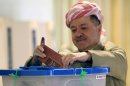 Kurdish regional president Massud Barzani casts his ballot at a polling station in Arbil, on September 21, 2013