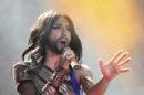Austrian singer and Eurovision Song Contest winner Conchita Wurst performs on stage during the opening ceremony of the Life Ball in front of City Hall in Vienna, Austria, Saturday, May 31, 2014. The Life Ball is a charity gala to raise money for people living with HIV and AIDS. (AP Photo/Ronald Zak)