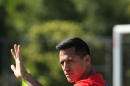 Chile's national team player Alexis Sanchez waves during a training session at Toca da Raposa 2, in Belo Horizonte, Brazil, Monday, June 9, 2014. Chile will play in group B of the Brazil 2014 World Cup. (AP Photo/Bruno Magalhaes)