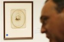 Selby Kiffer, American manuscript expert at Sotheby's, in front of a signed portrait of Confederate General, Robert E. Lee to be auctioned by Sotheby's in New York