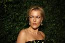 US actress Gillian Anderson poses on the red carpet as she attends the 60th London Evening Standard Theatre Awards 2014 in London on November 30, 2014